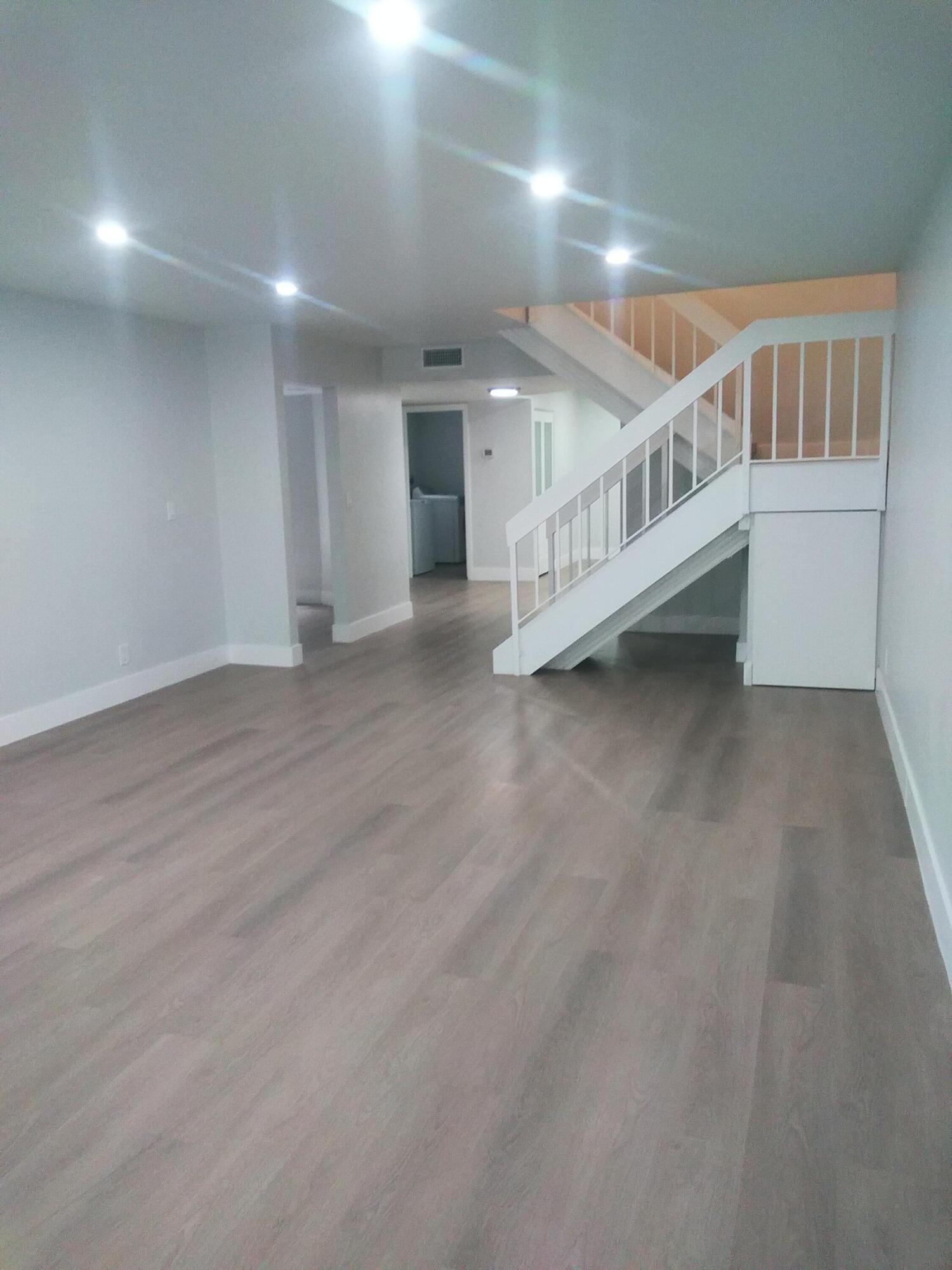 9727 North New River Canal Road, Unit 629 Plantation, FL 33324 - Photo 6 of 28 a view of an empty room with stairs