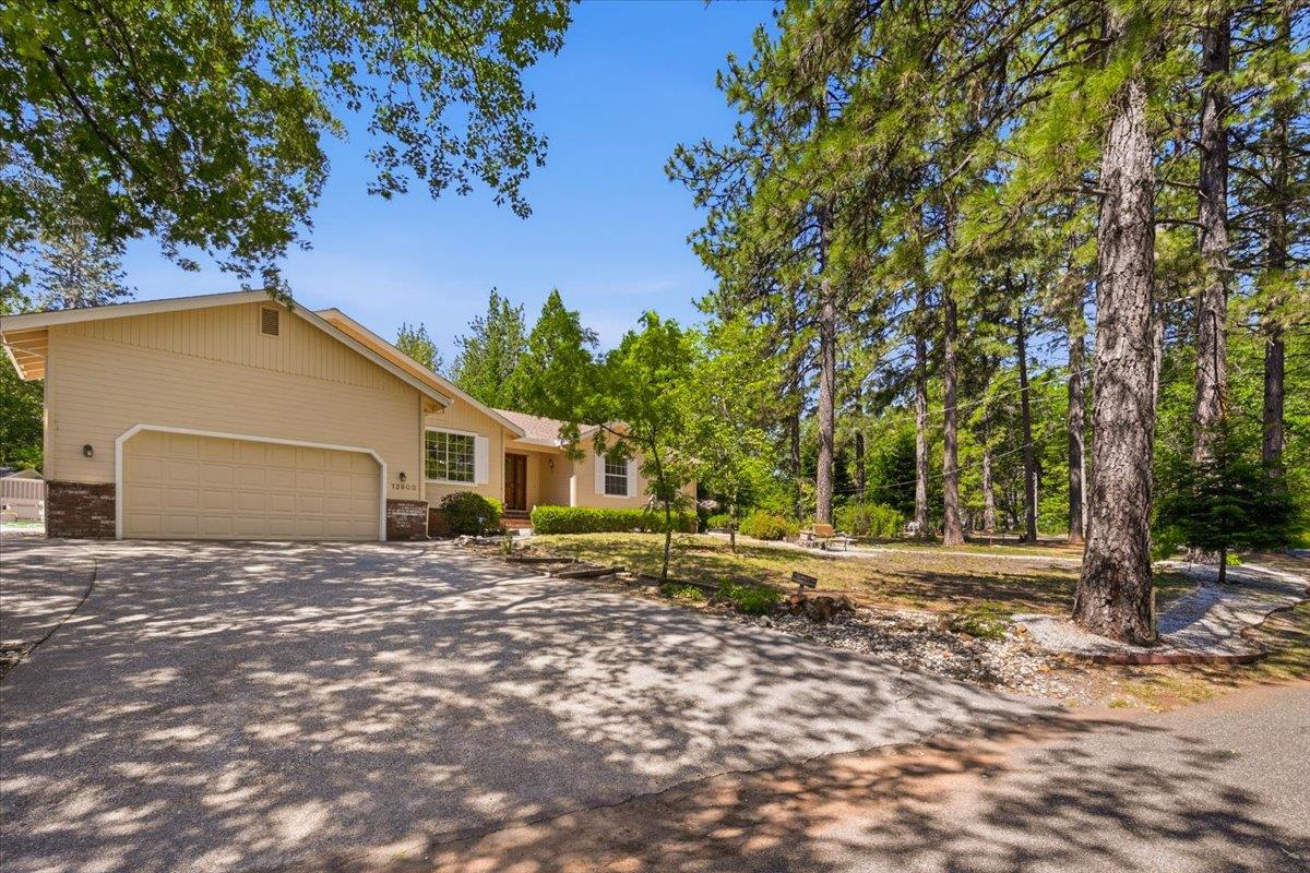 12600 Friar Tuck Road Grass Valley, CA 95949 - Photo 50 of 56 a house with trees in the background