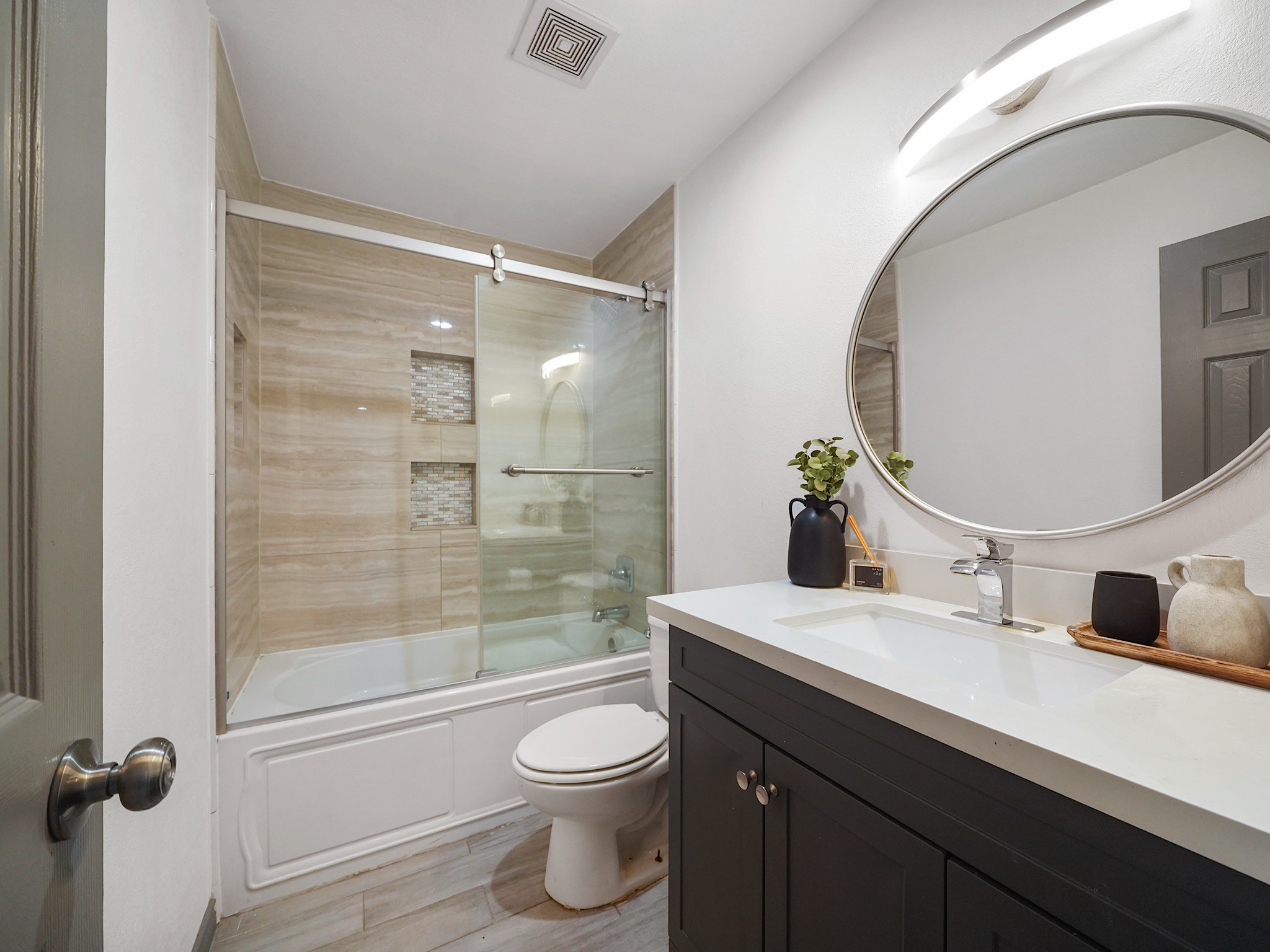 9616 Long Point Road, Unit 47 Houston, TX 77055 - Photo 11 of 15 A well-appointed full bath with a large vanity and shower-tub combination showcases crisp finishes for everyday ease.