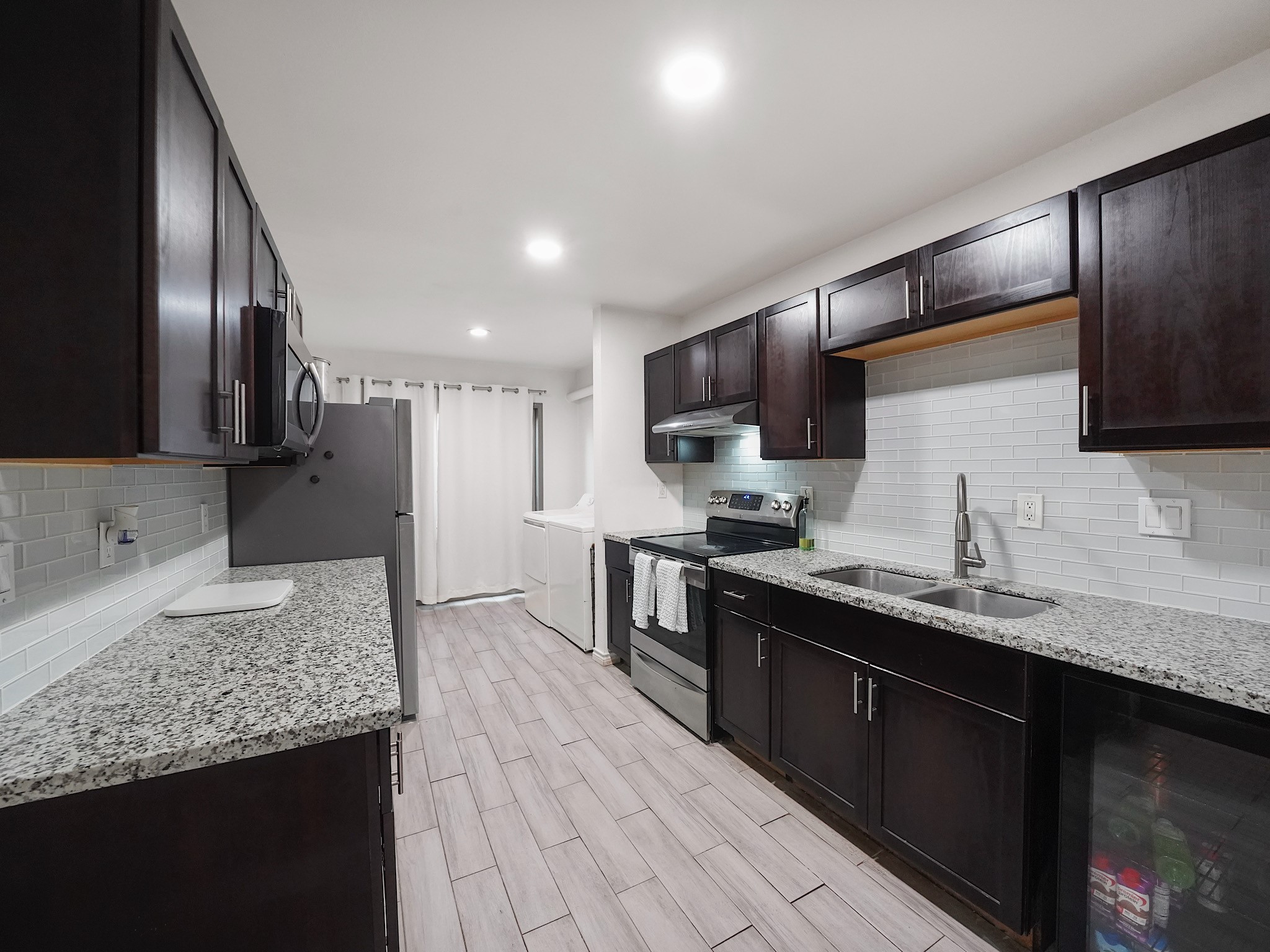 9616 Long Point Road, Unit 47 Houston, TX 77055 - Photo 6 of 15 The kitchen features granite countertops and abundant cabinetry, surrounding a workspace designed for both quick weekday meals and ambitious weekend cooking.