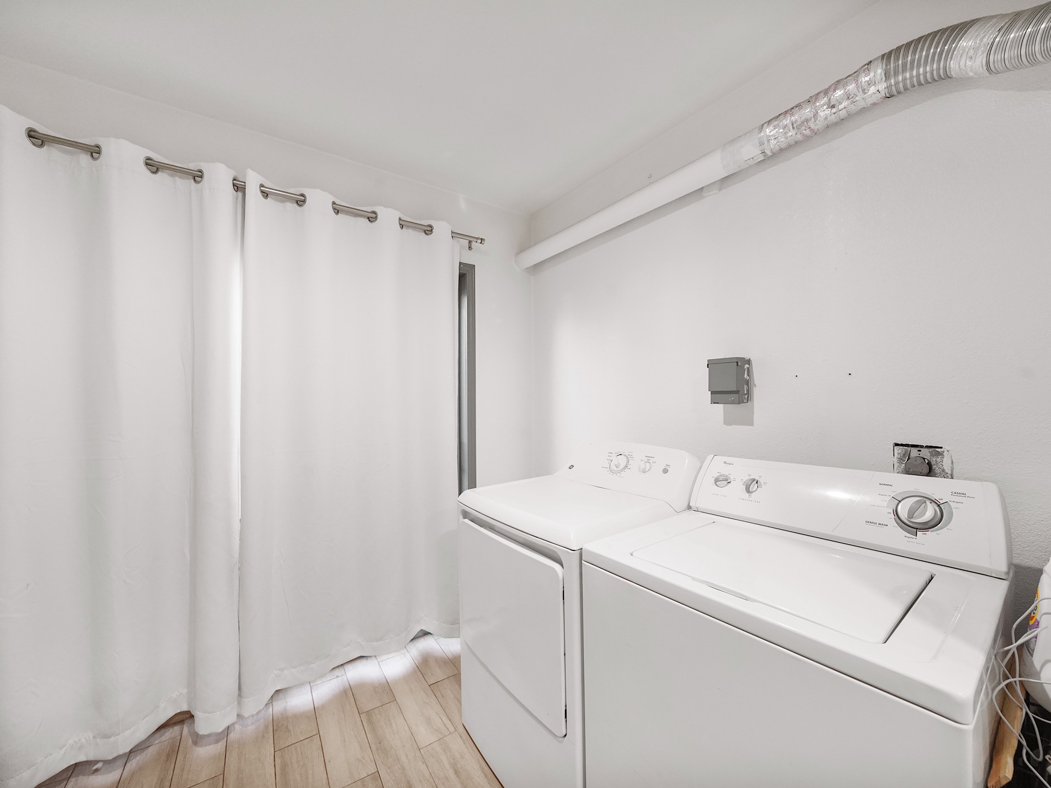 9616 Long Point Road, Unit 47 Houston, TX 77055 - Photo 8 of 15 The laundry area is conveniently situated adjacent to the kitchen for easy access.