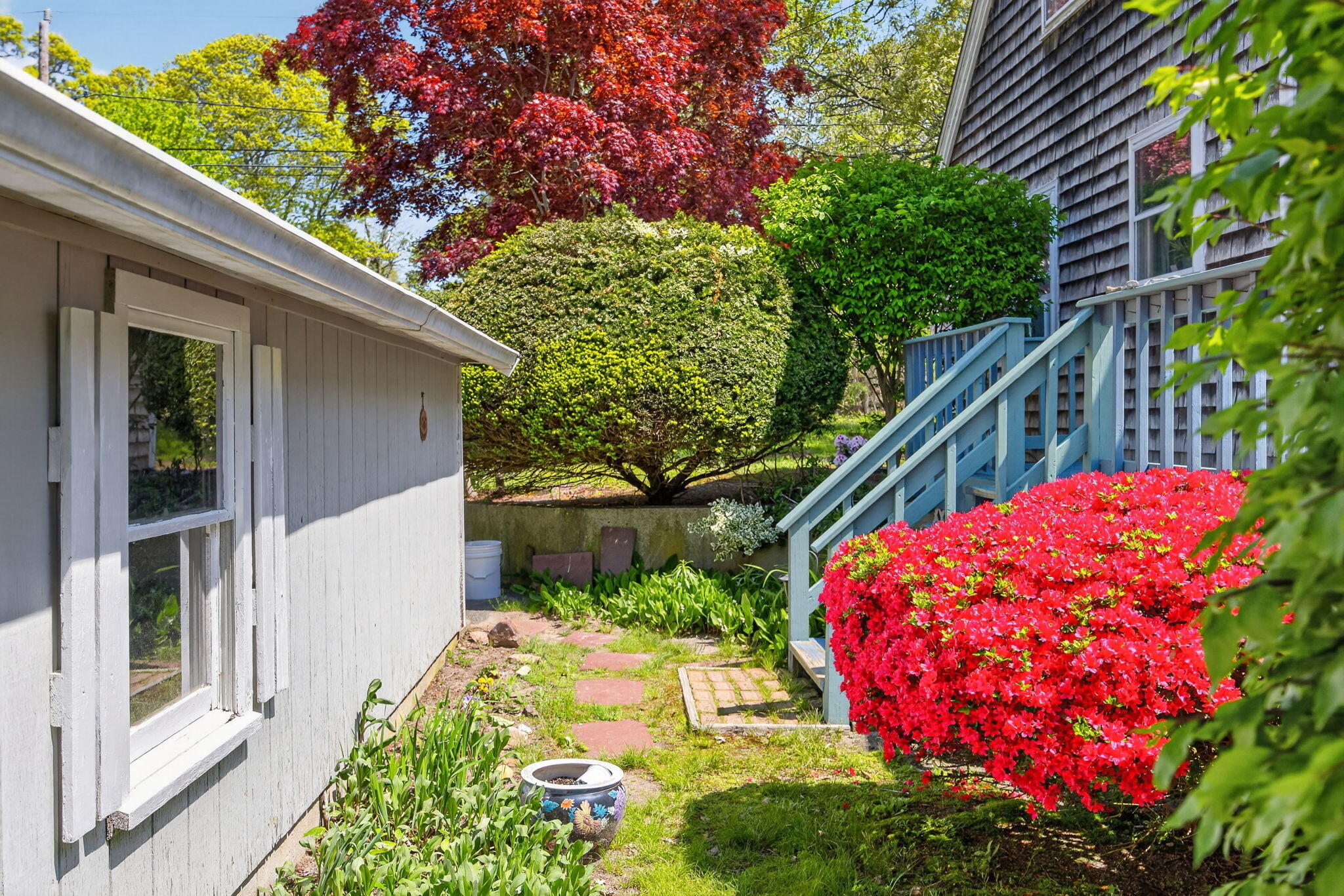 23 Nickerson Road Orleans, MA 02653 - Photo 35 of 54 a view of a backyard with flower plants