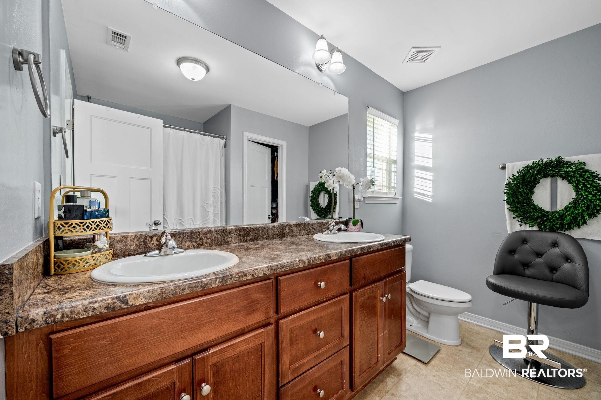 9366 Fox Run Court Semmes, AL 36575 - Photo 21 of 29 Bathroom with tile patterned flooring, vanity, toilet, and walk in shower