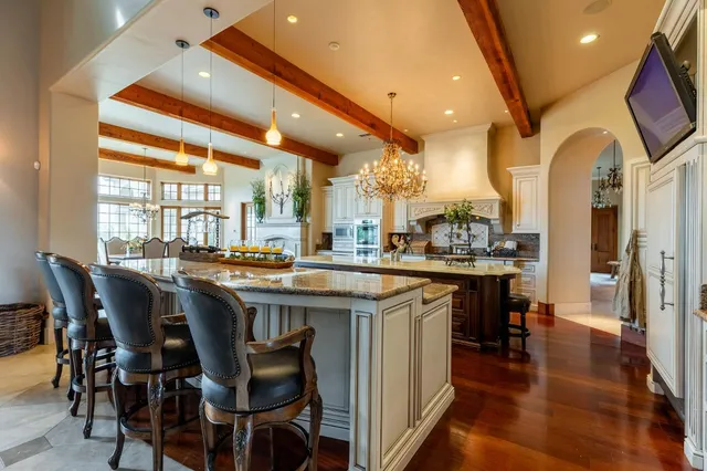 a living room with a bed furniture and a large window