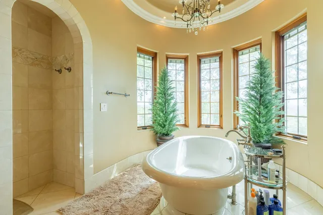 a view of a backyard with sitting area