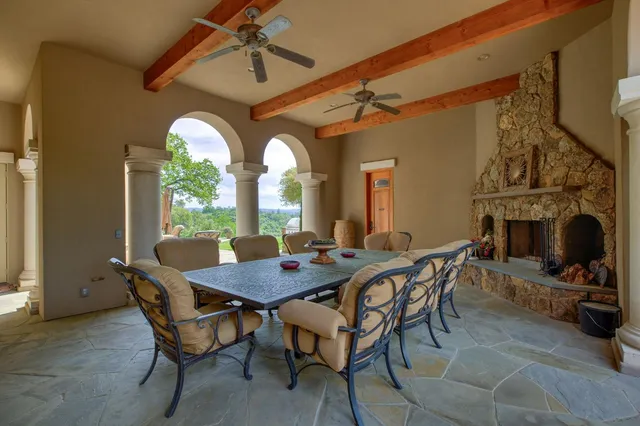 a kitchen with kitchen island granite countertop lots of counter top space and stainless steel appliances