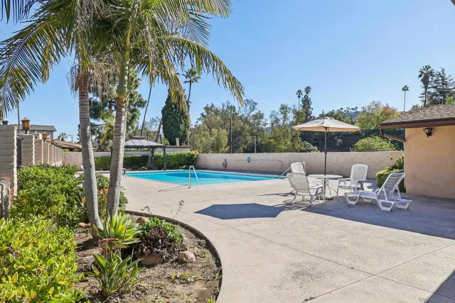 a view of a backyard with a sitting area and furniture