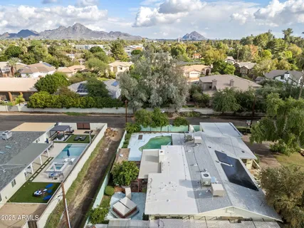 an aerial view of a house with a garden