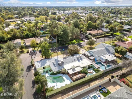 an aerial view of residential houses with outdoor space