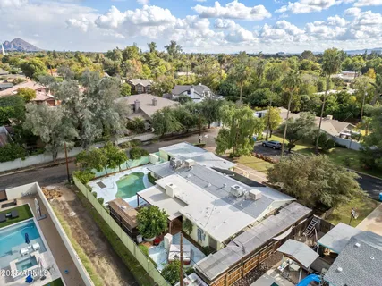 an aerial view of a house with a yard