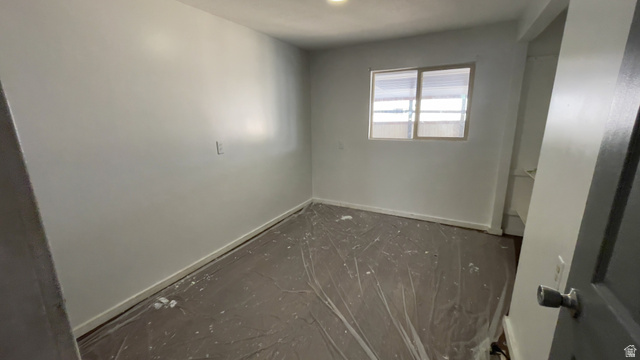 2491 Highway 89, Unit 114 Pleasant View, UT 84404 - Photo 5 of 18 Spare room with baseboards
