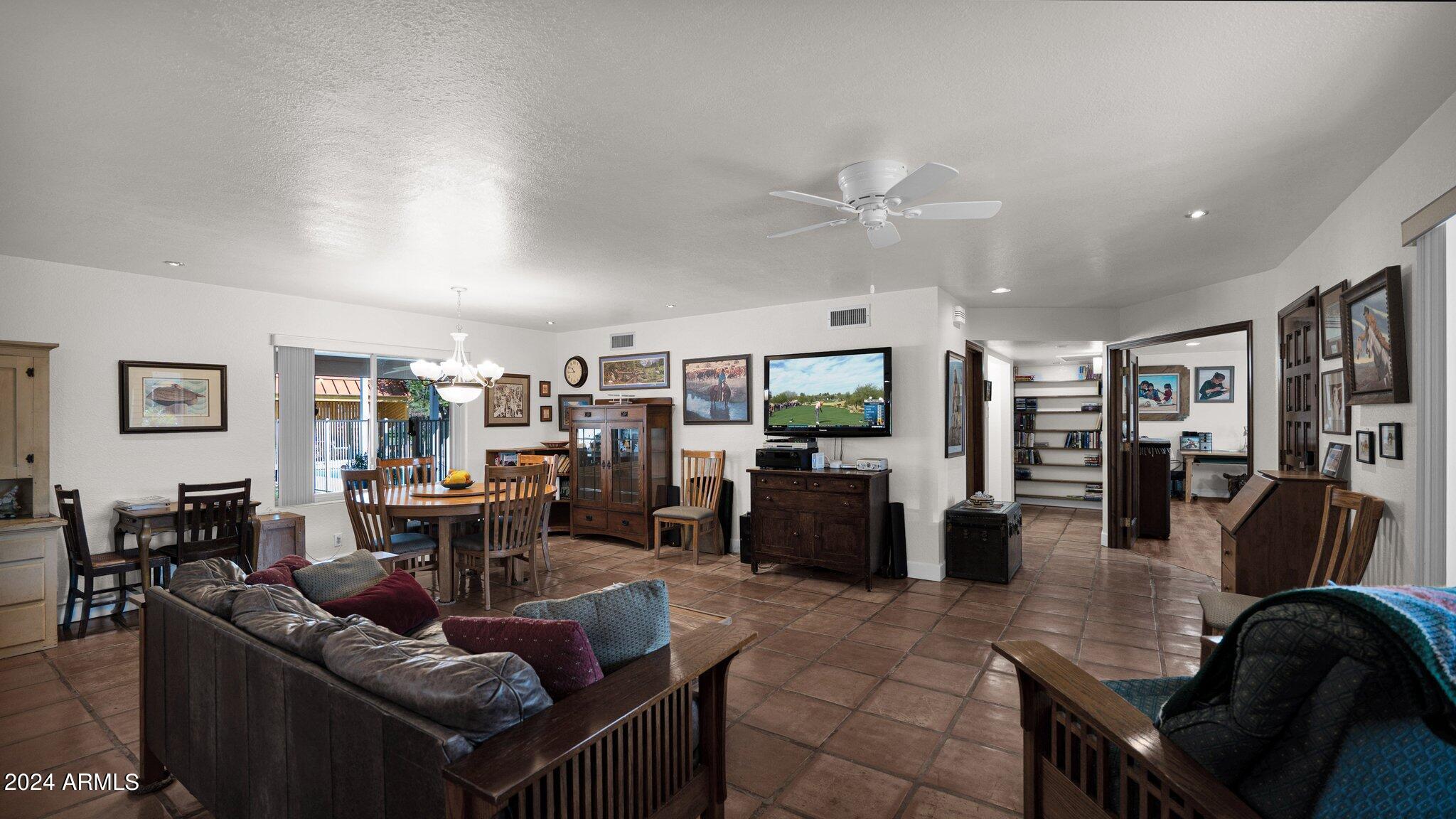 814 East Harwell Road Gilbert, AZ 85234 - Photo 12 of 35 a living room with furniture kitchen view and a large window