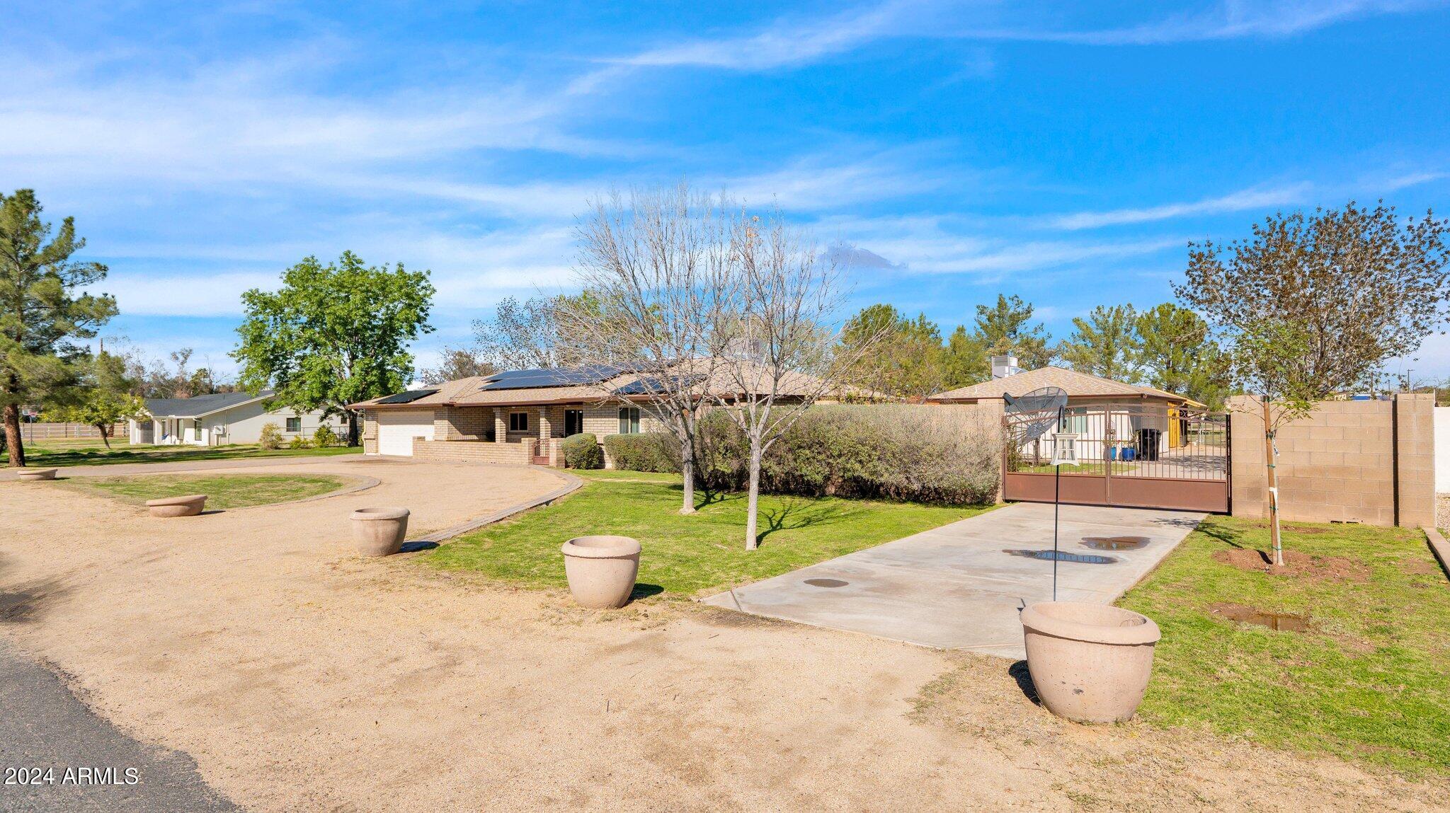 814 East Harwell Road Gilbert, AZ 85234 - Photo 2 of 35 a view of a house with a yard