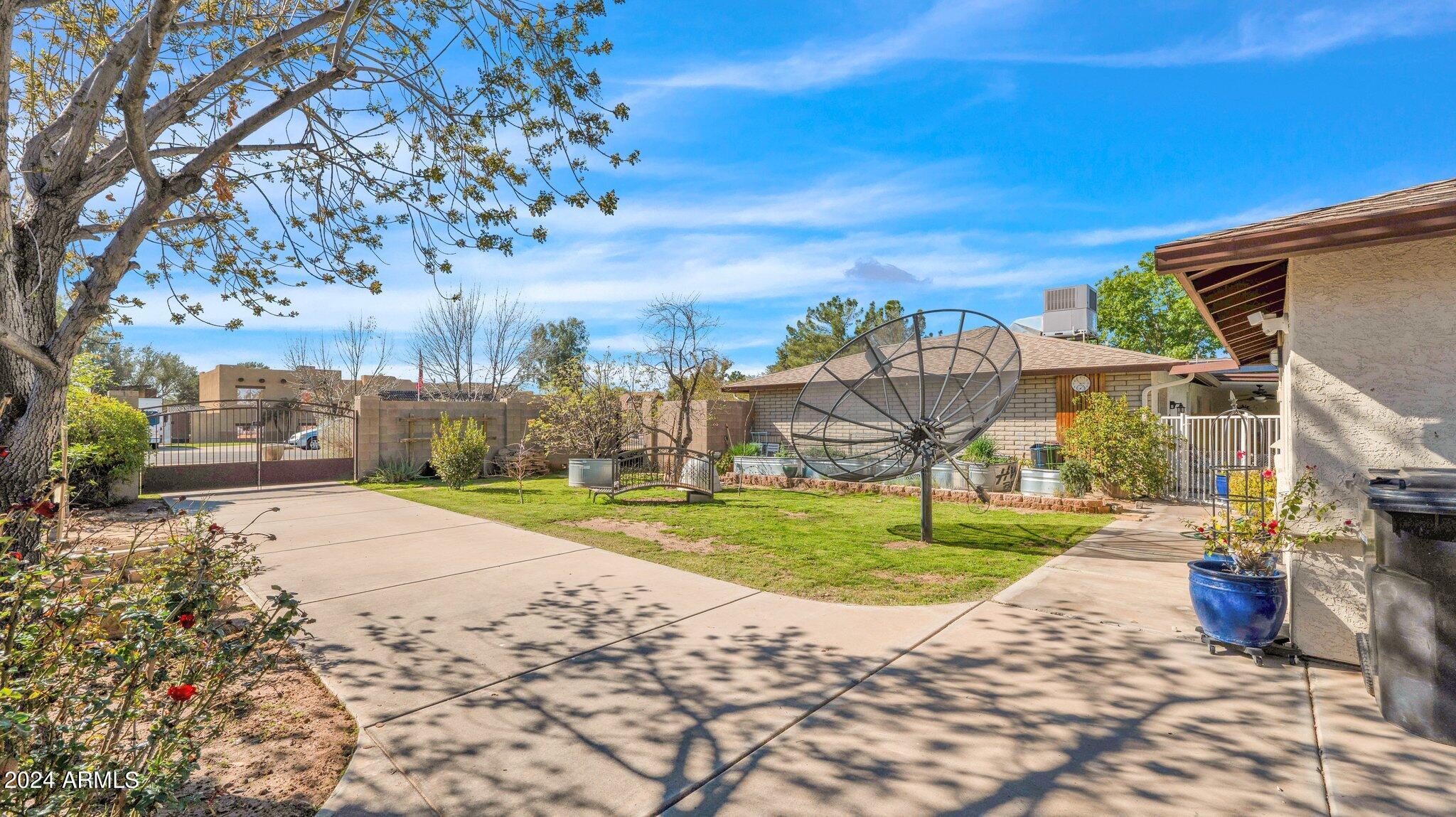 814 East Harwell Road Gilbert, AZ 85234 - Photo 25 of 35 a view of a big yard next to a road