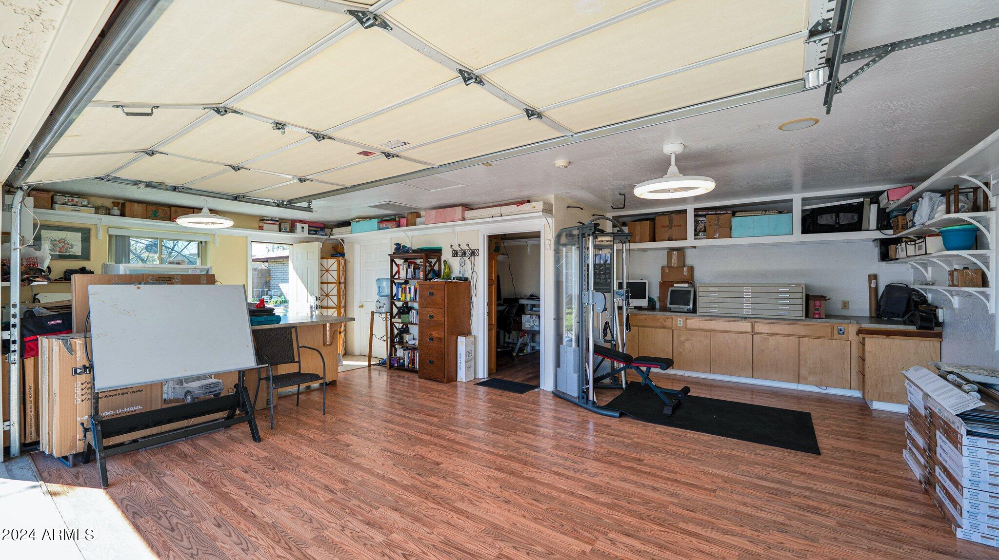 814 East Harwell Road Gilbert, AZ 85234 - Photo 31 of 35 a living room with furniture and a wooden floor