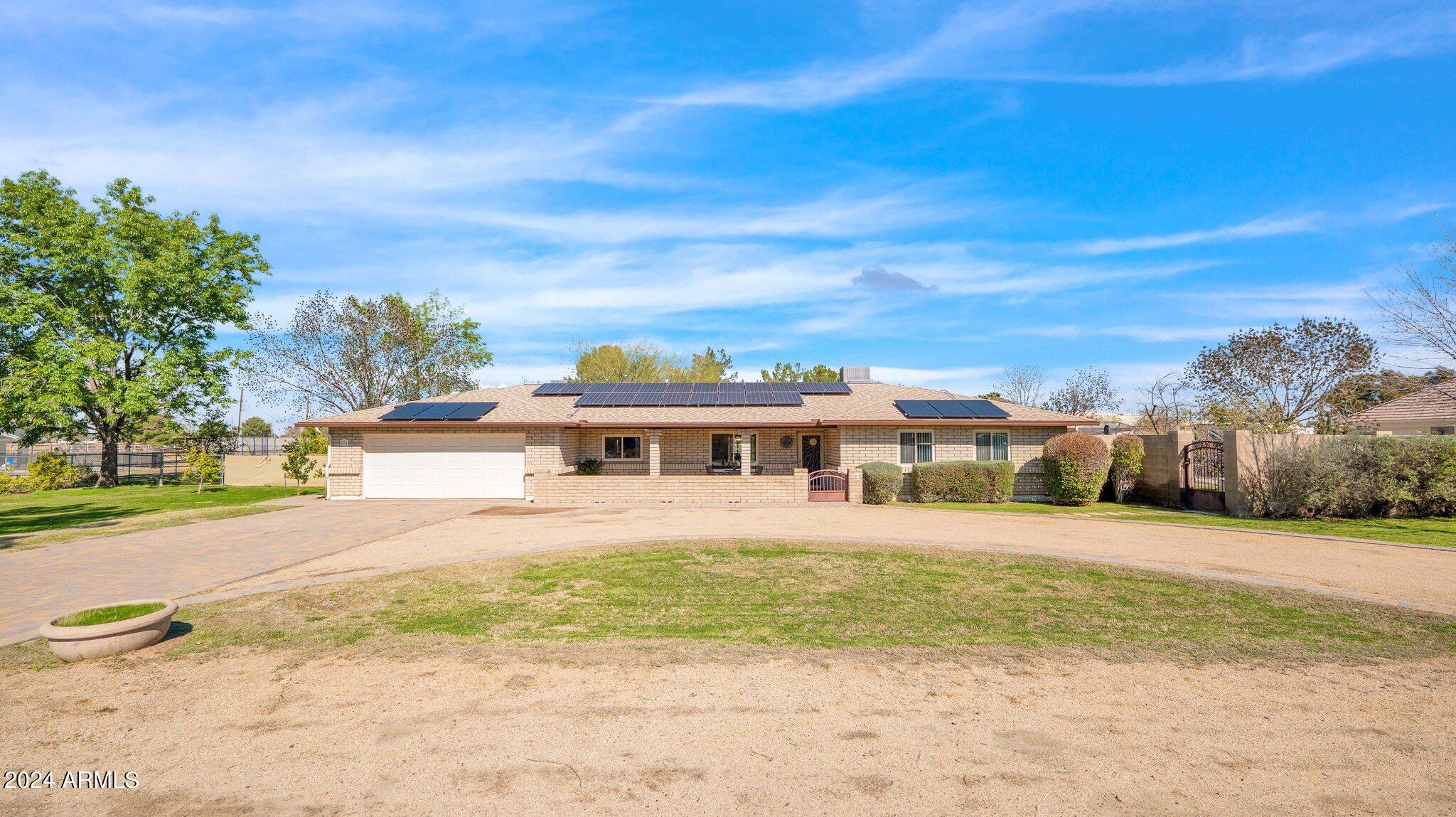 814 East Harwell Road Gilbert, AZ 85234 - Photo 35 of 35 a front view of residential houses with yard