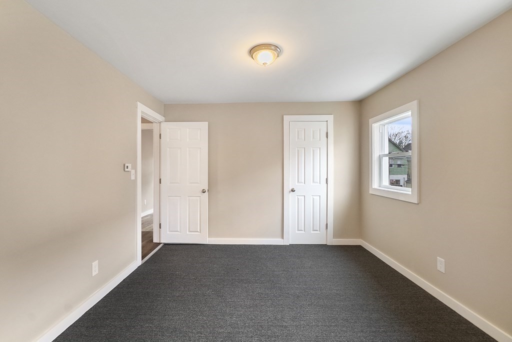 43 Wait Street Springfield, MA 01104 - Photo 4 of 18 a view of an empty room with a window
