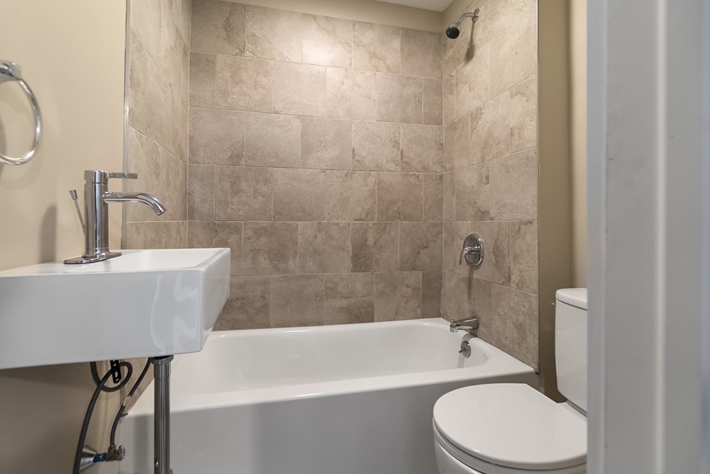 43 Wait Street Springfield, MA 01104 - Photo 9 of 18 a bathroom with a sink a toilet and bathtub