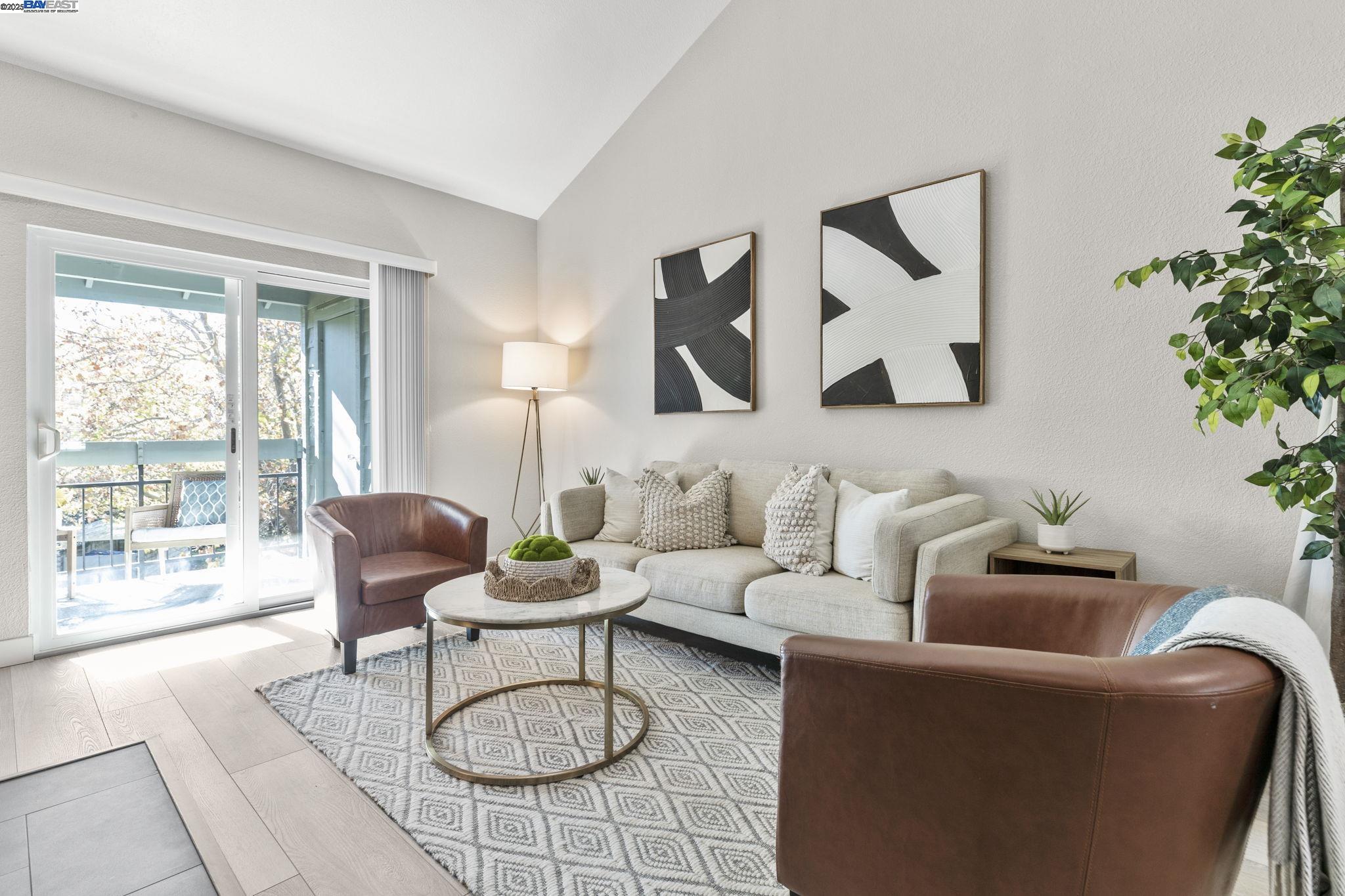 8170 Mountain View Drive, Unit F Pleasanton, CA 94588 - Photo 11 of 51 a living room with furniture a rug and a large window