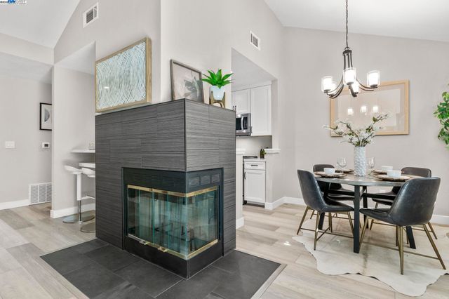 a dining room with furniture and chandelier