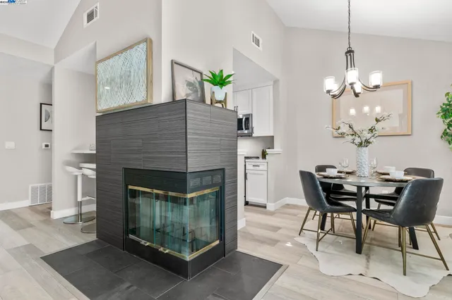 a dining room with furniture and chandelier