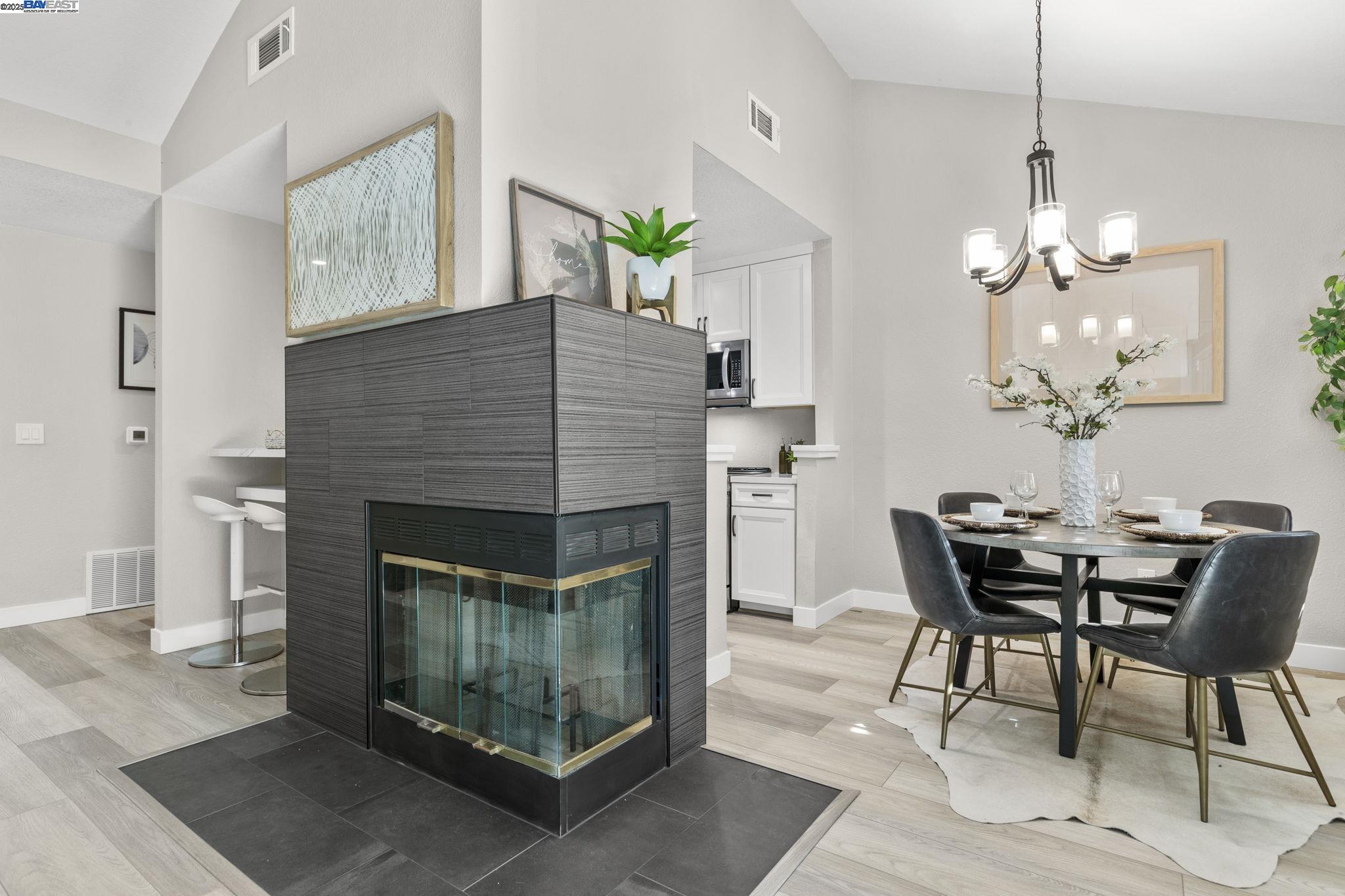 8170 Mountain View Drive, Unit F Pleasanton, CA 94588 - Photo 12 of 51 a dining room with furniture and chandelier