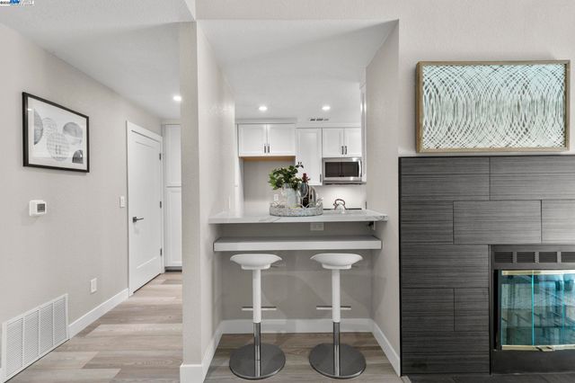 a kitchen with a sink cabinets and window