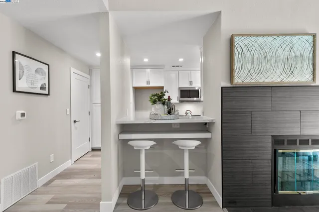 a kitchen with a sink cabinets and window