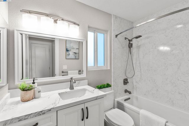 a bathroom with a sink a toilet and a bathtub