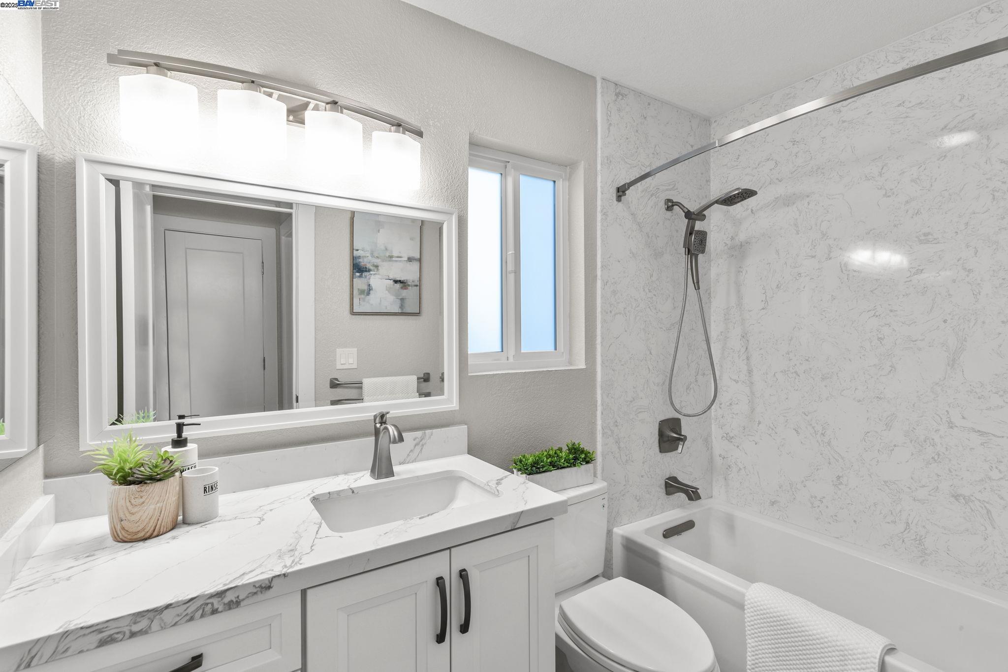 8170 Mountain View Drive, Unit F Pleasanton, CA 94588 - Photo 29 of 51 a bathroom with a sink a toilet and a bathtub