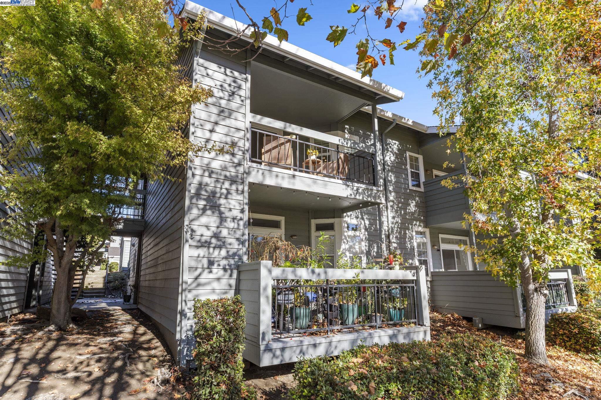 8170 Mountain View Drive, Unit F Pleasanton, CA 94588 - Photo 3 of 51 front view of a house with a yard