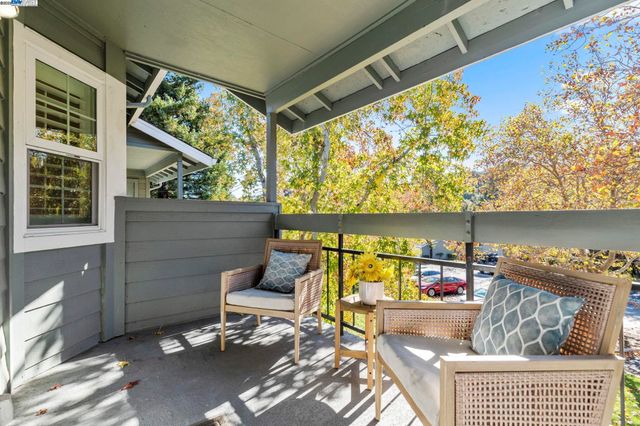 a outdoor living space with furniture and a potted plant