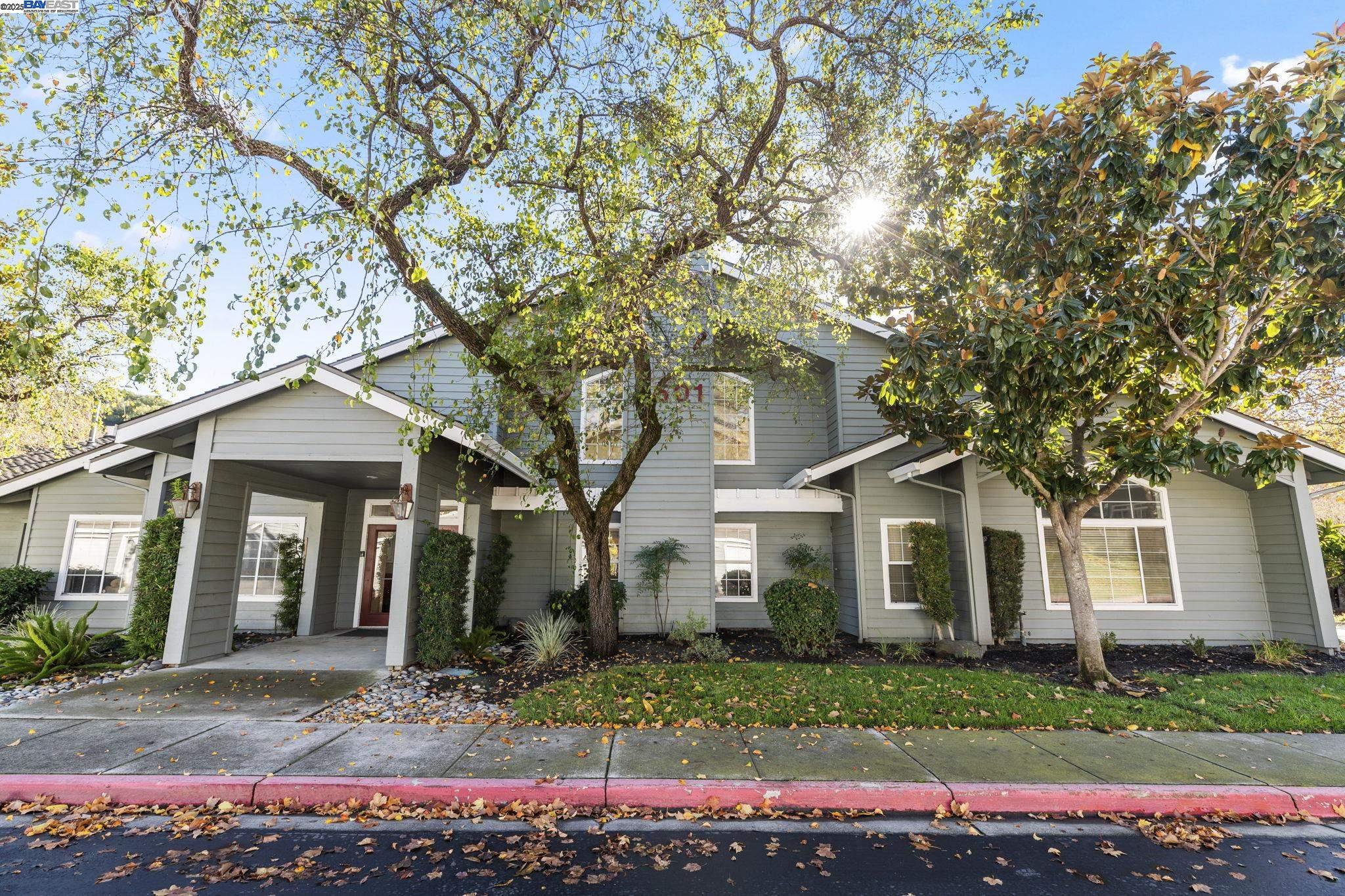 8170 Mountain View Drive, Unit F Pleasanton, CA 94588 - Photo 42 of 51 a front view of a house with a garden