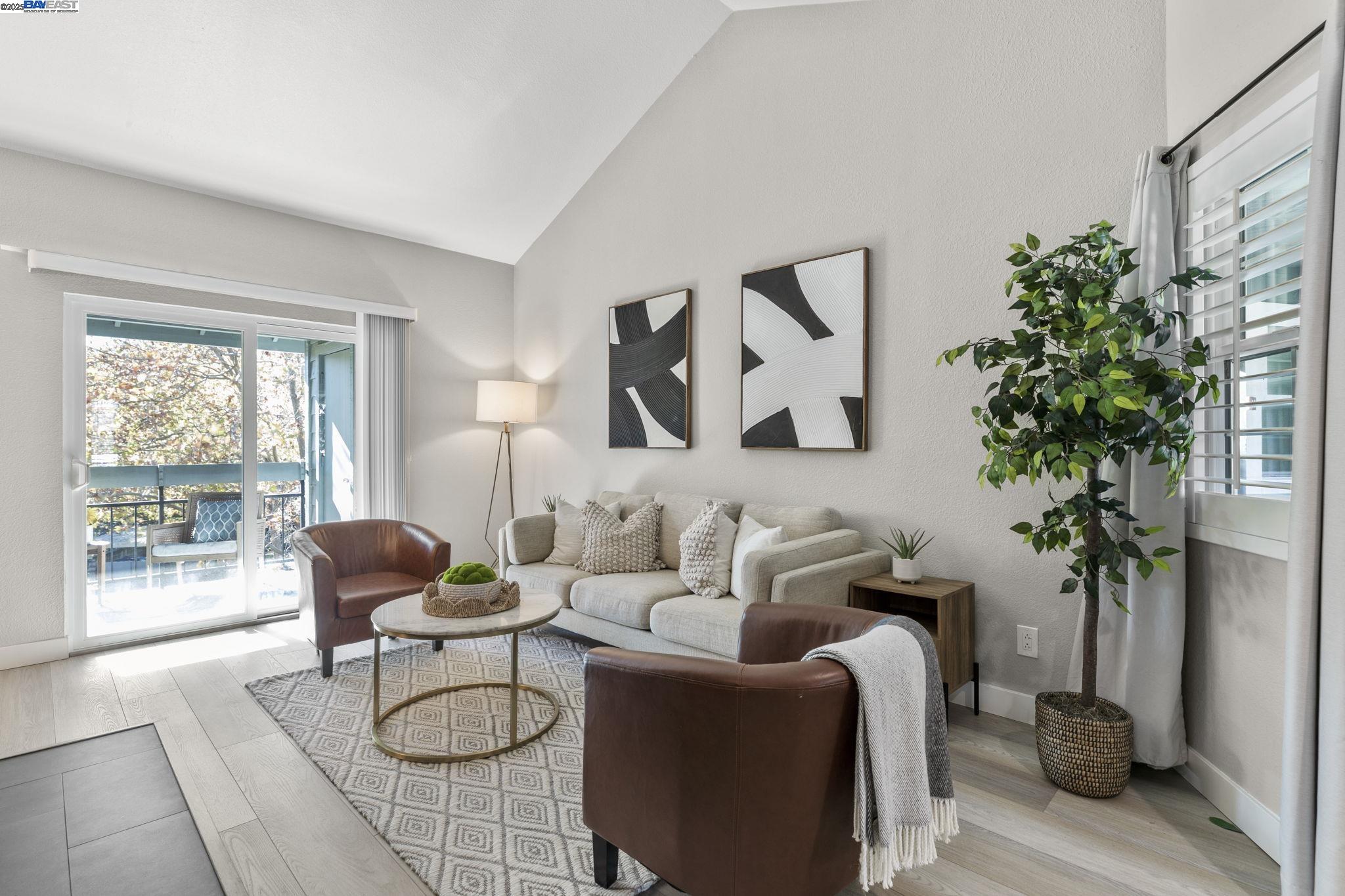 8170 Mountain View Drive, Unit F Pleasanton, CA 94588 - Photo 6 of 51 a living room with furniture and a potted plant