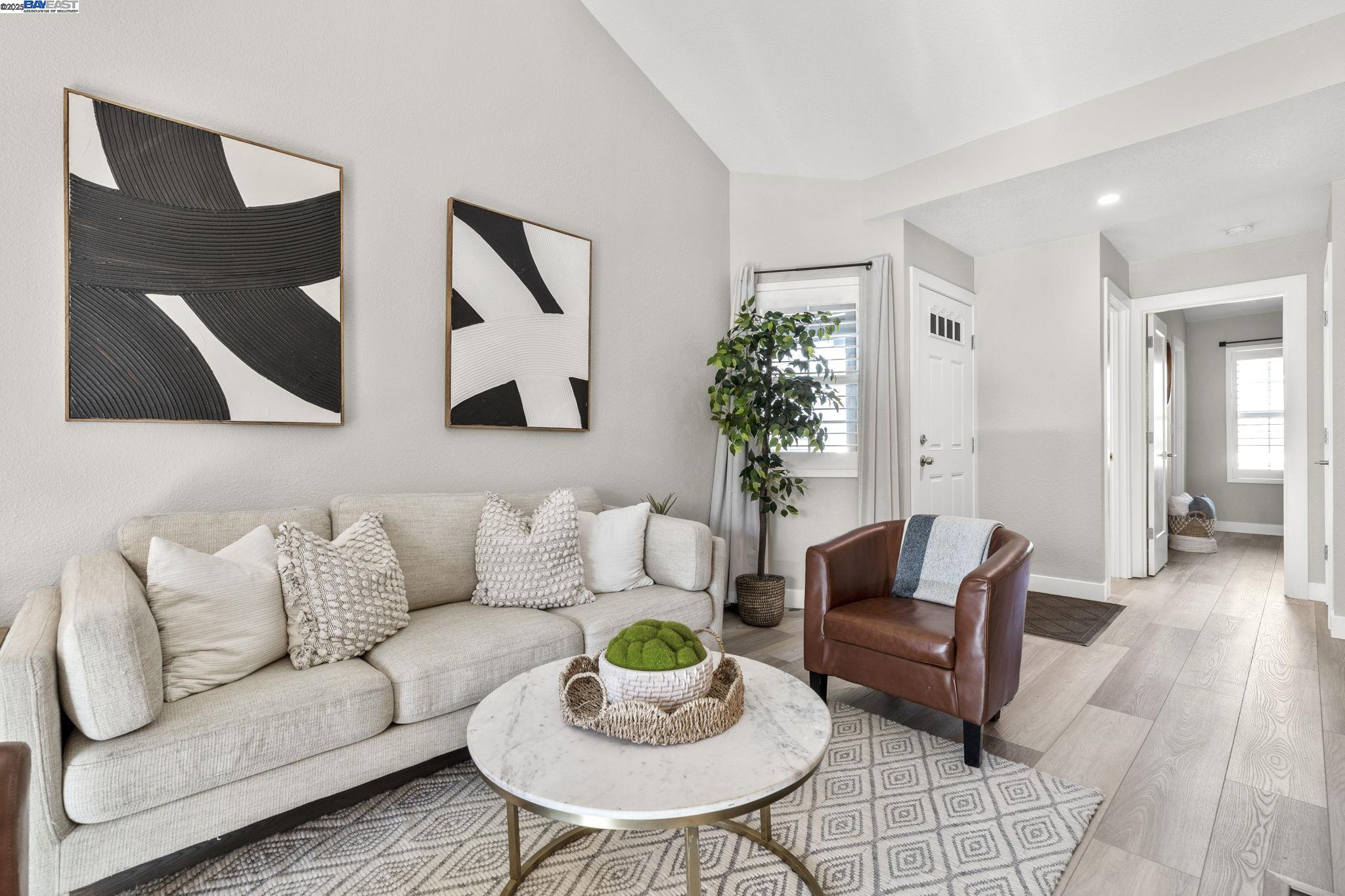 8170 Mountain View Drive, Unit F Pleasanton, CA 94588 - Photo 10 of 51 a living room with furniture and a potted plant