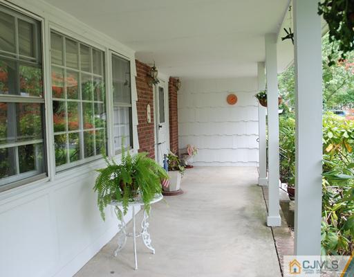 5 Chandler Road Edison, NJ 08820 - Photo 2 of 23 a potted plant sitting in front of a door