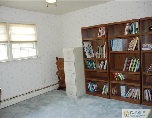 5 Chandler Road Edison, NJ 08820 - Photo 14 of 23 a view of room with furniture and book shelf
