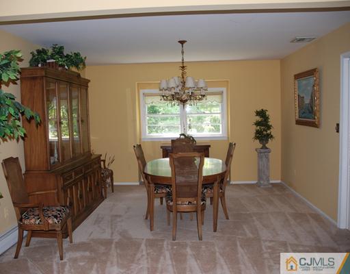 5 Chandler Road Edison, NJ 08820 - Photo 4 of 23 a view of a dining room with furniture and window