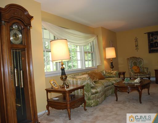 5 Chandler Road Edison, NJ 08820 - Photo 5 of 23 a living room with furniture and a window