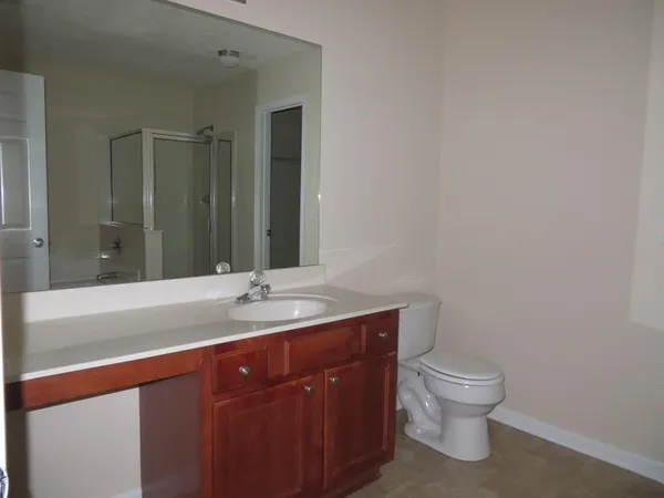 a bathroom with a glass shower door