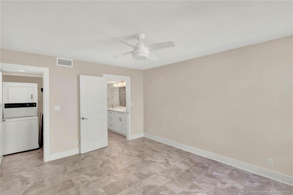 1950 Southwest Palm City Road, Unit 14305 Stuart, FL 34994 - Photo 43 of 70 an empty room with closet and a ceiling fan