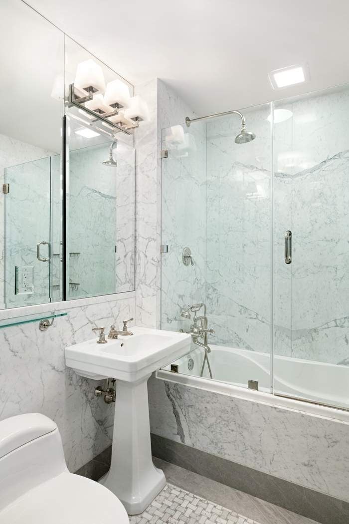 823 Park Avenue, Unit 4 Manhattan, NY 10021 - Photo 10 of 14 a bathroom with a sink mirror toilet and bathtub