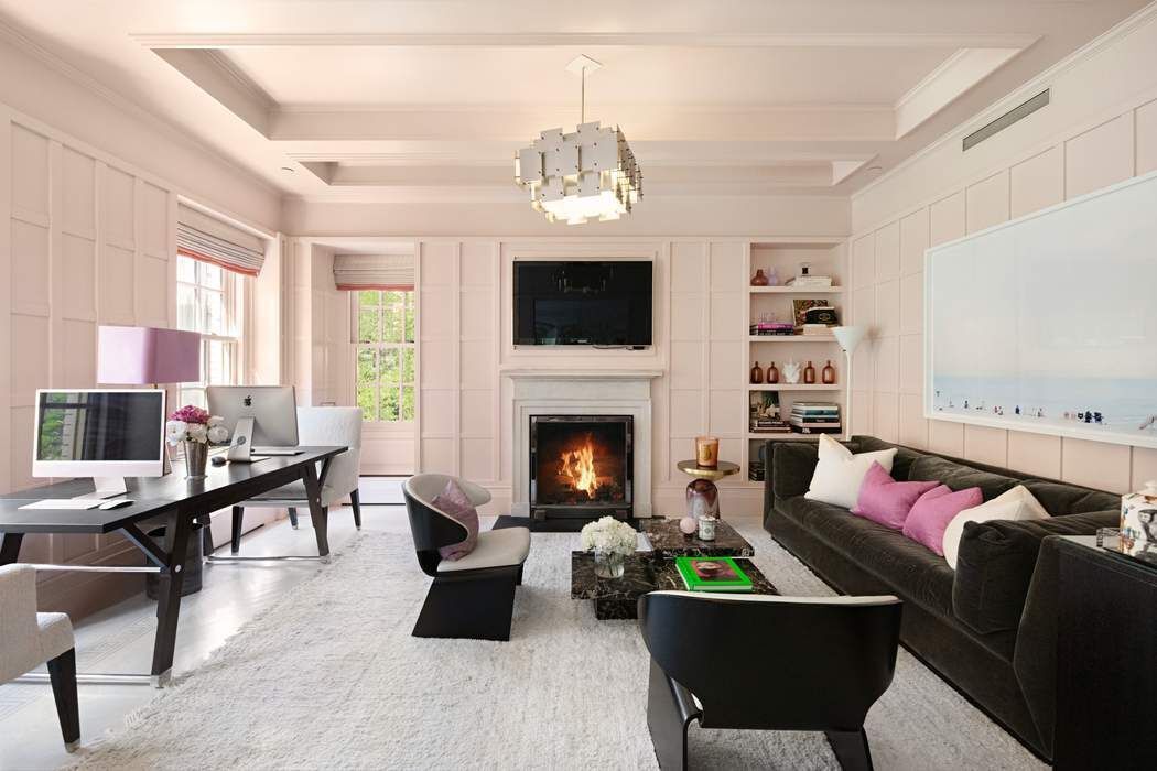 823 Park Avenue, Unit 4 Manhattan, NY 10021 - Photo 2 of 14 a living room with furniture fireplace and a flat screen tv