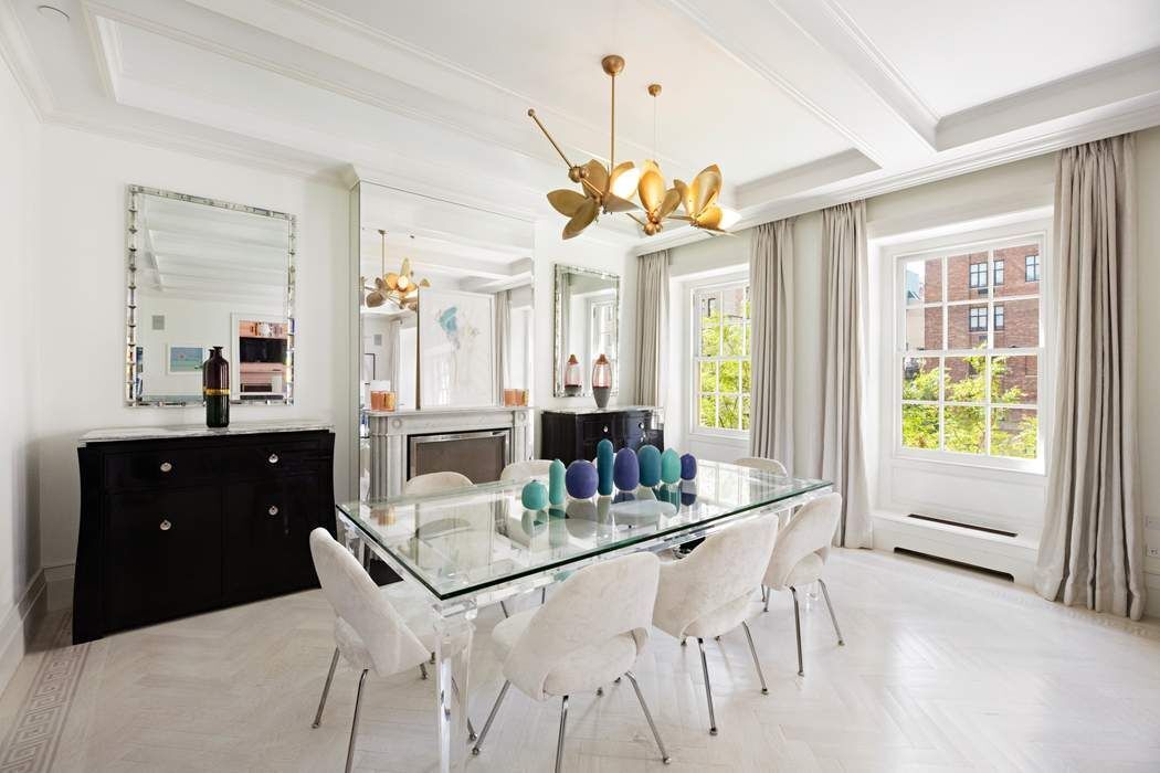 823 Park Avenue, Unit 4 Manhattan, NY 10021 - Photo 3 of 14 a view of a dining room with furniture and a chandelier