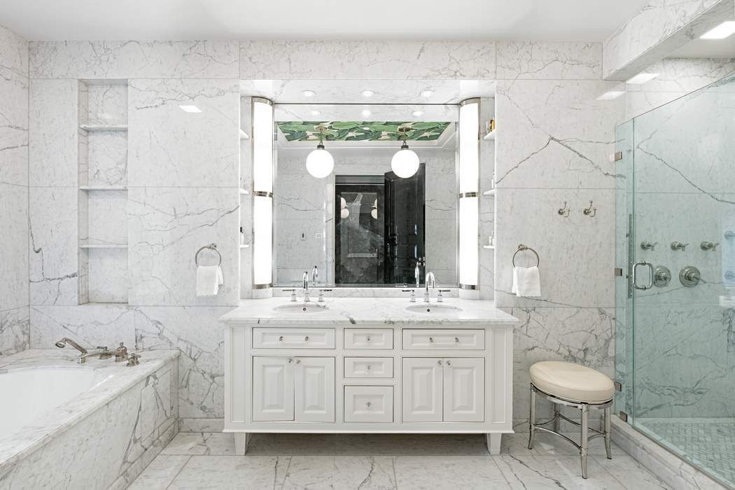 823 Park Avenue, Unit 4 Manhattan, NY 10021 - Photo 8 of 14 a bathroom with a double vanity sink mirror and toilet