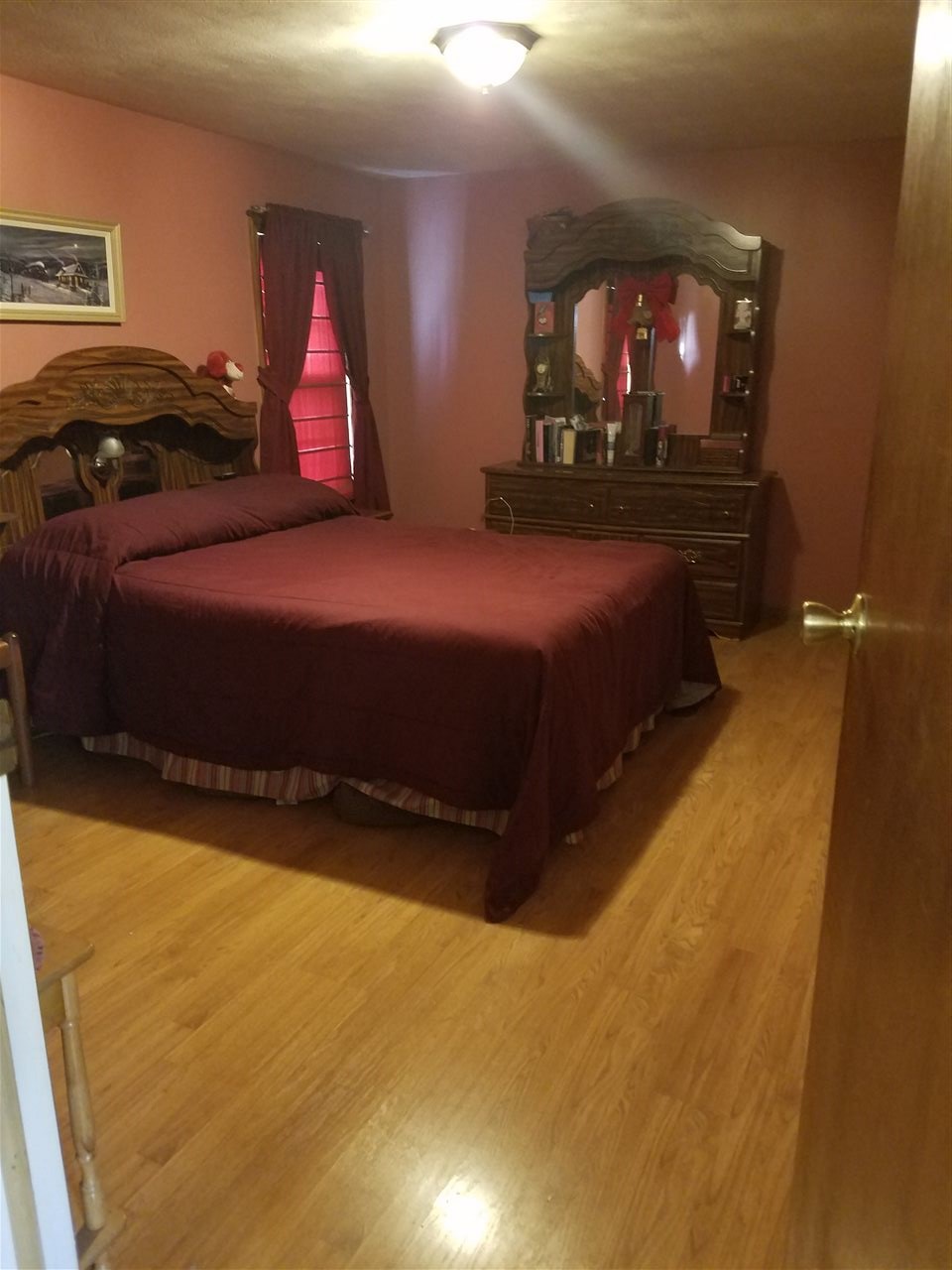 5273 Cold Springs Road Raphine, VA 24472 - Photo 25 of 37 a bedroom with a bed and a lamp on dresser