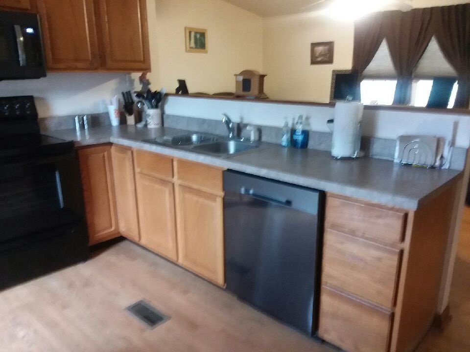 5273 Cold Springs Road Raphine, VA 24472 - Photo 36 of 37 a kitchen with stainless steel appliances granite countertop a sink stove and cabinets