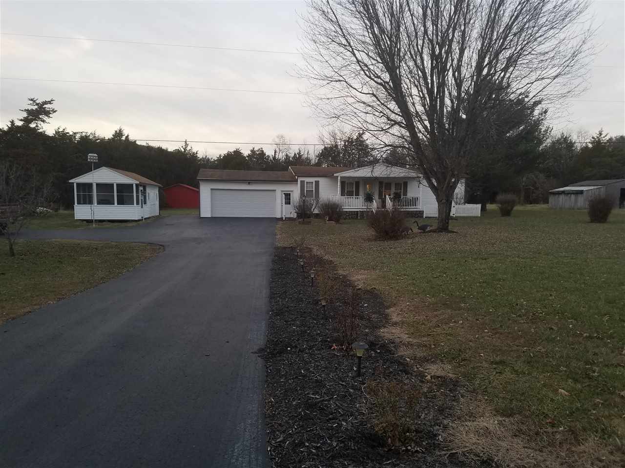 5273 Cold Springs Road Raphine, VA 24472 - Photo 5 of 37 a front view of a house with a yard and trees