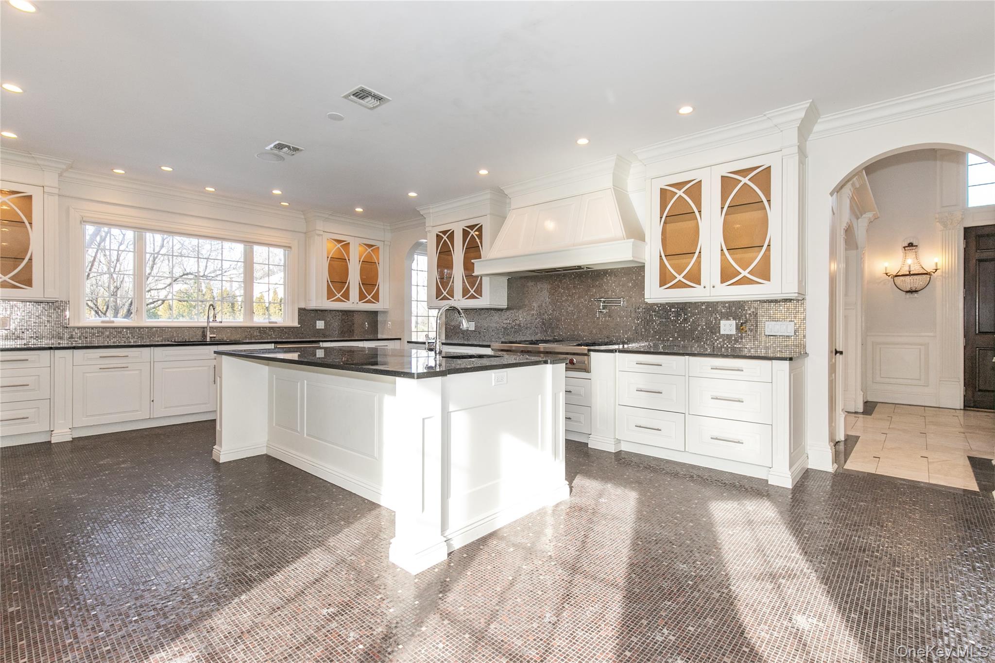 12 Knollwood Road Roslyn, NY 11576 - Photo 13 of 41 a large kitchen with stainless steel appliances kitchen island granite countertop a stove a sink and a granite counter tops