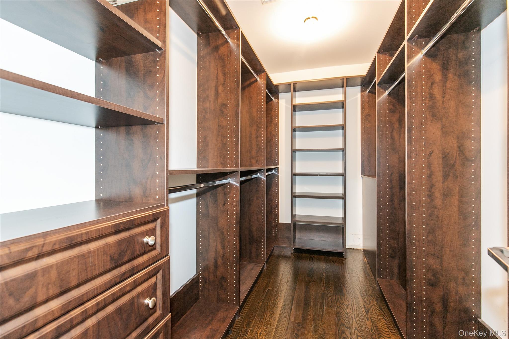 12 Knollwood Road Roslyn, NY 11576 - Photo 22 of 41 a view of walk in closet with empty racks